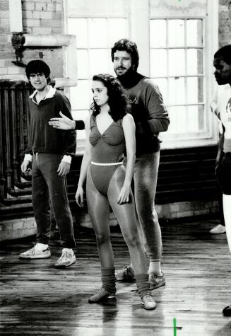 Dramatic debut: Ron Base, resplendent in workout pants, stands behind Cynthia Dale while another actor looks on during scene from Hevenly Bodies