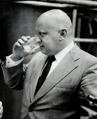 Ron Basford drinks a glass of water