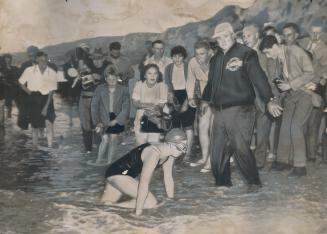 Gus Ryder holds crowd back as Marilyn Crawls ashore to triumph