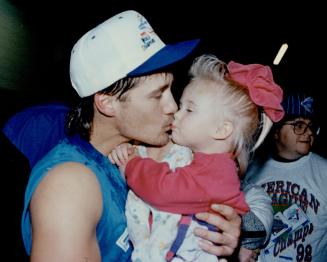 Apres win: Blue Jays catcher Pat Borders, wife Kathy and their daughter  Lindsay, 22 months, enjoy a meal after Toronto clinched a division title  yesterday – All Items – Digital Archive Ontario