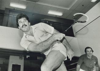 New interest: Blue Jay's centre fielder Rick Bosetti, only member of the team to stay in Toronto for the off season, has found a new activity to help keep him in shape - squash