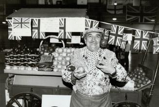 British Invasion. Sydney Burstoff shows off his fruit at the British Show in the Automotive Building at Exhibition Place. Proceeds from his fruit stan(...)