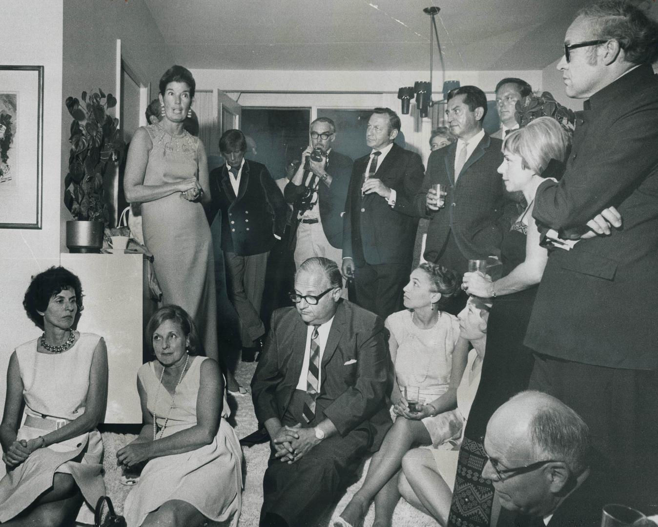 June Callwood, still shaken from being arrested Wednesday night during the Yorkville disturbances, talks to the guests of Mr. and Mrs. Frank Shuster a(...)