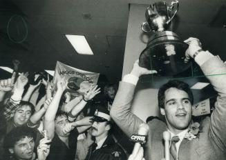 It's home - Slotback Jan Carinci shows off the cup