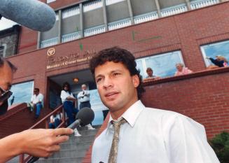 The judgement: Judge Sidney Harris threw the book at Dino Ciccarelli, below with, for throwing three shots at Leaf defenceman Luke Richardson, below left