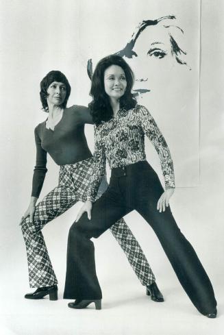 Lois Smith models jacquard apres-ski pants with body sweater while Adrienne Clarkson wears international look of black knit pants combined with clingy print skirt