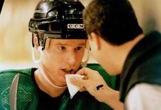 Brandon Convery (Los Angeles Rings) gets cut lip tended to