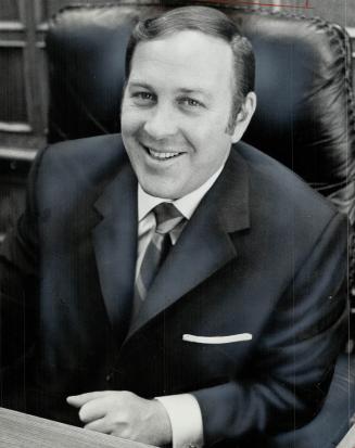 Norton Cooper, youthful president of Seaway Multi-Corp