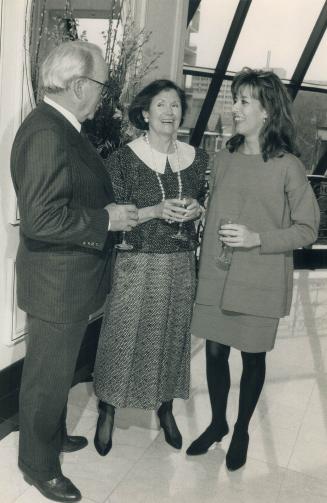 Above, left to right, Jim Crang, his wife Shirley in a two-piece Zoe silk and Catherine Demeroutis