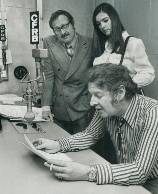 On the air, Earl Warren opens his show on CFRB radio, watched by Anne-Marie Jurkovich, 18