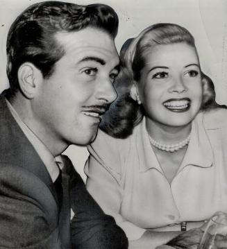 New Movieland romance is that of actor John Payne and actress Gloria De Haven, shown here in a night club