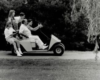 Grandchildren join the former chief justice on the golf cart he uses to get around his farm, where he raises horses, spotted deer and Barbary sheep. F(...)