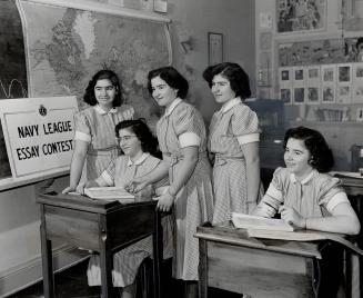 Competing in the Navy League's national essay contest on the subject Our Navy and Seaborne Trade in Our Daily Life, the Dionne quintuplets ponder over(...)