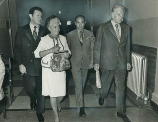 Leaving inquiry for lunch today, are Richard Duke, left, Mrs