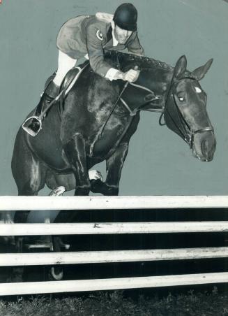 Up and over go Canadian equestrian team member Moffat Danlap and his mount Argyll