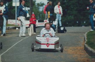 Toronto Mayor Art Eggleton roars down the High Park raceway during politicians' time trials at the Big Brothers' 23rd annual soapbox derby yesterday. (...)