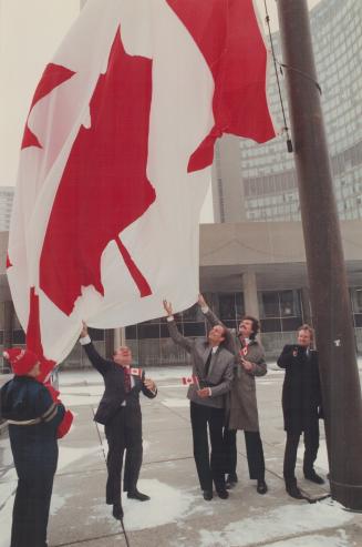 Mayor Art Eggleton, right, hoists the flag on its 25th birthday yesterday together with, from left, a civic worker and Toronto councillors Bill Boytch(...)