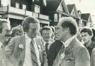 Art Eggleton (left) had a hand from Pierre Trudeau while mainstreeeting Parkdale last week