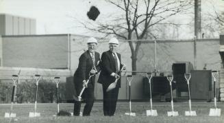 Here's mud in your eye. Patients Johnny Esaw, left, and Gus Arrigo help break the ground for the expansion of the Toronto Rehabilitation Centre's card(...)