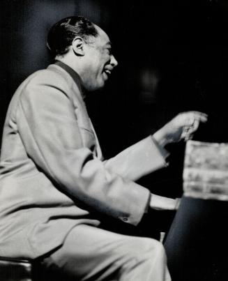 Duke Ellington at the piano. 'I write for people in the band'