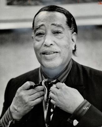 Jazz great Duke Ellington died of pneumonia and cancer today in New York
