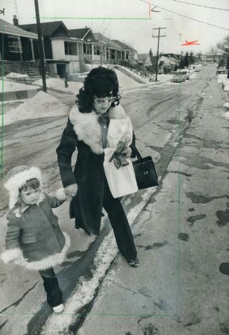 Three-year-old child and Mary Feldstein, who's raised the little girl from infancy, return home after a shopping trip yesterday. The Feldsteins will a(...)