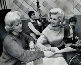 Florida, here we come . . . Joan Fairfax (right) checks things out with pianist Marie Peeker as she readies her 14-piece all-girl band for its first e(...)