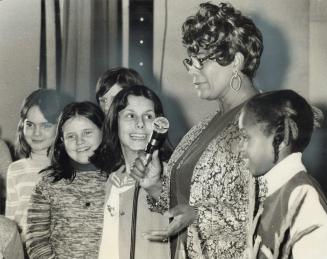 Singer Ella Fitzgerald is surrounded by young fans after her concert yesterday in the Royal York Hotel for 1,000 children from inner-city schools. The(...)