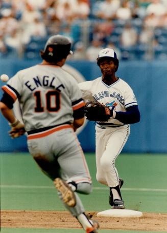 It isn't easy: Throws from second base to first sometimes look easy to the spectators but the strain on the face and neck of the Jays' shortstop Tony Fernandez yesterday proves this isn't so