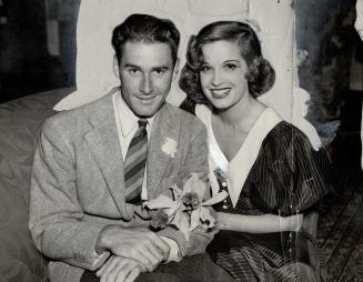 Errol Flynn, a new favorite of the film fans, with his wife Lili Damita, the popular actress