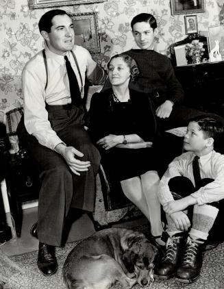 Fighter's family at home shows, left to right, Moose, his stepmother