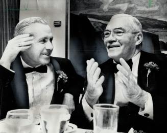 The Former Chairmen of Metro Toronto, William Allen (left) and Fred (Big Daddy) Gardiner, reminisce about their terms of office at a dinner given for (...)