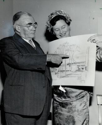 Metro Chairman Gardiner, Mrs. Newman with sketch of wing