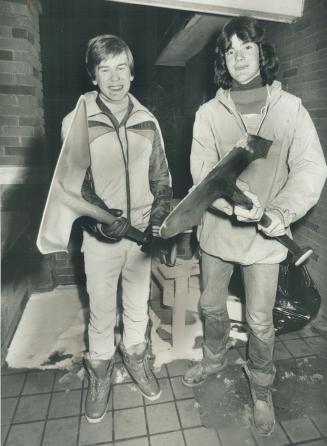 Ted Lalonde (right) and Jimmy Bryson display shovels they used to stop a thief