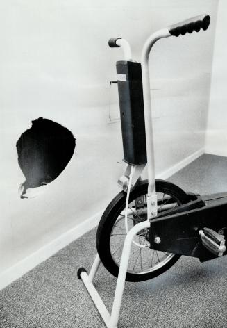 Vandalism caused hole in the wall of exercise room in high-rise apartment building