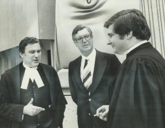As his murder trial began yesterday, Mississauga builder Peter Demeter (centre) talked outside Middlesex County Courthouse in London. Ont., with his a(...)