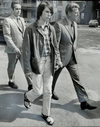 David Thurston flanked by detectives, Winston Weatherbie (left) and George Thompson