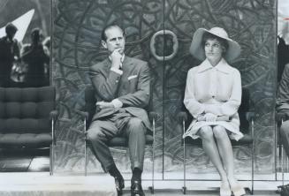 Prince Philip and Margaret Trudeau, wife of the Prime Minister, listen to the Queen as she officially opens the Lester B. Pearson external affairs bui(...)