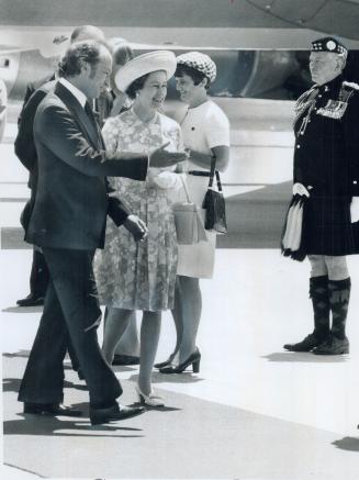 On Arrival at Toronto International Airport yesterday, the Queen is met by Prime Minister Pierre Trudeau and Mrs