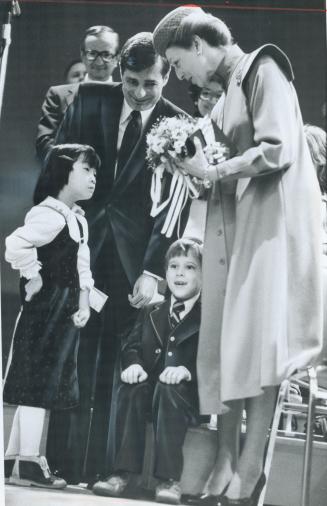 Posy for a princess, Andrew Soucette, 7, perhaps a little overwhelmed, sits after give View School yesterday