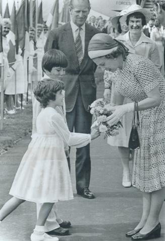 Royal presentation: Queen Elizabeth accepts bouquet on arrival in Saskatoon during 1978 visit to Canada