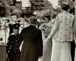 The Queen chatting with Hon. Thomas D. Pattullo, premier of British Columbia, on arrival of Victoria