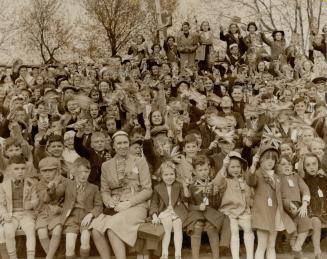 At Kingston, left centre thousands of happy children crowded the stadium at Queen's university