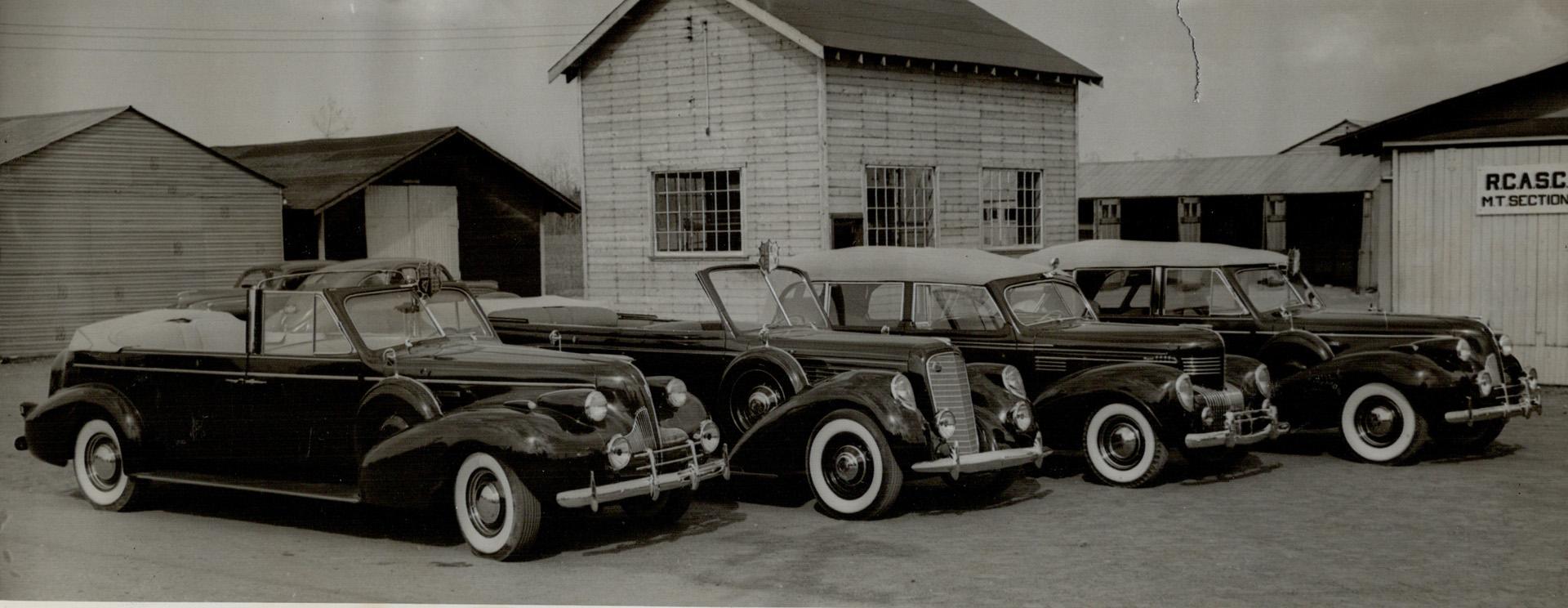 In These cars their Majesties Will Ride: Lined up early today at Camp Borden were these four long, sleek limousines-all four finished in royal purple