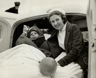 Although bundled up, this Ottawa child, lower left, managed to smile and wave a Union Jack while a nurse watched with him from an ambulance