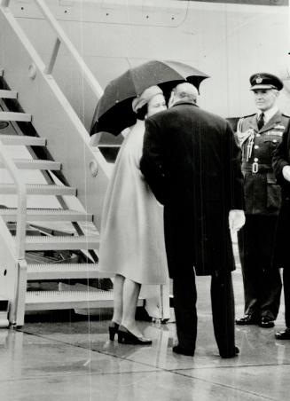 Goodbye kiss: The Queen and Prince Philip end their Canadian tour at Sudbury, October 1984