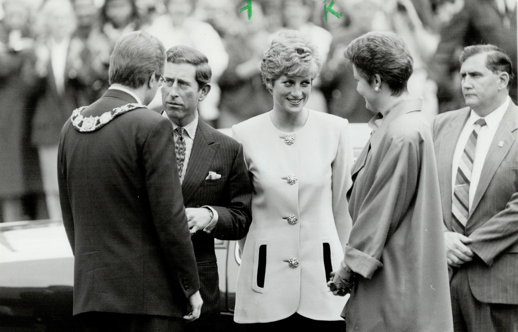 Shy Di: Princess Diana smiles shyly at admirers in the crowd