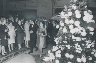 Top right: Princess Margaret and Lord Snowdon, are greeted as they enter lobby of hotel at midnight last night