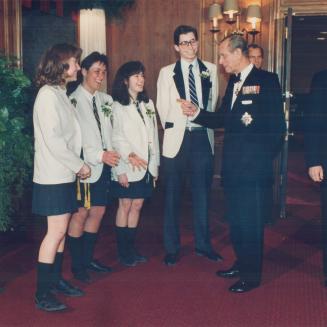Princely chat: On his way into the Duke of Edinburgh's Awards in Canada gala, 68-year-old Prince Philip stops to chat with students who acted as ushers at the fund-raiser
