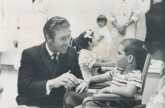 Man to man chat with Lord Snowdon was a real thrill for five-year-old Steven Bell, another patient in the hospital's newly-opened children's wing. [Incomplete]